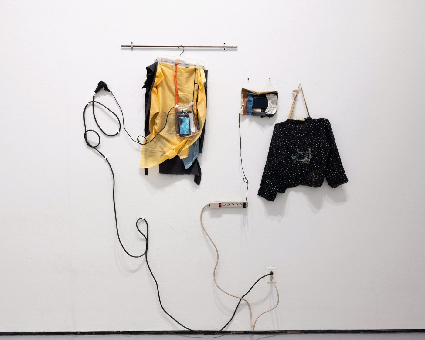 Anne Mailey with collaborators Katherine Yaochen Du and Goda Trakumaite, Conversations Between Cats and Clothes, 2020-2022. Fabric, found objects, cellphones, video, stop motion animations, clothing, thread; 76 x 82 in. Video 4 min, 55 sec. Photo: Allison Minto.